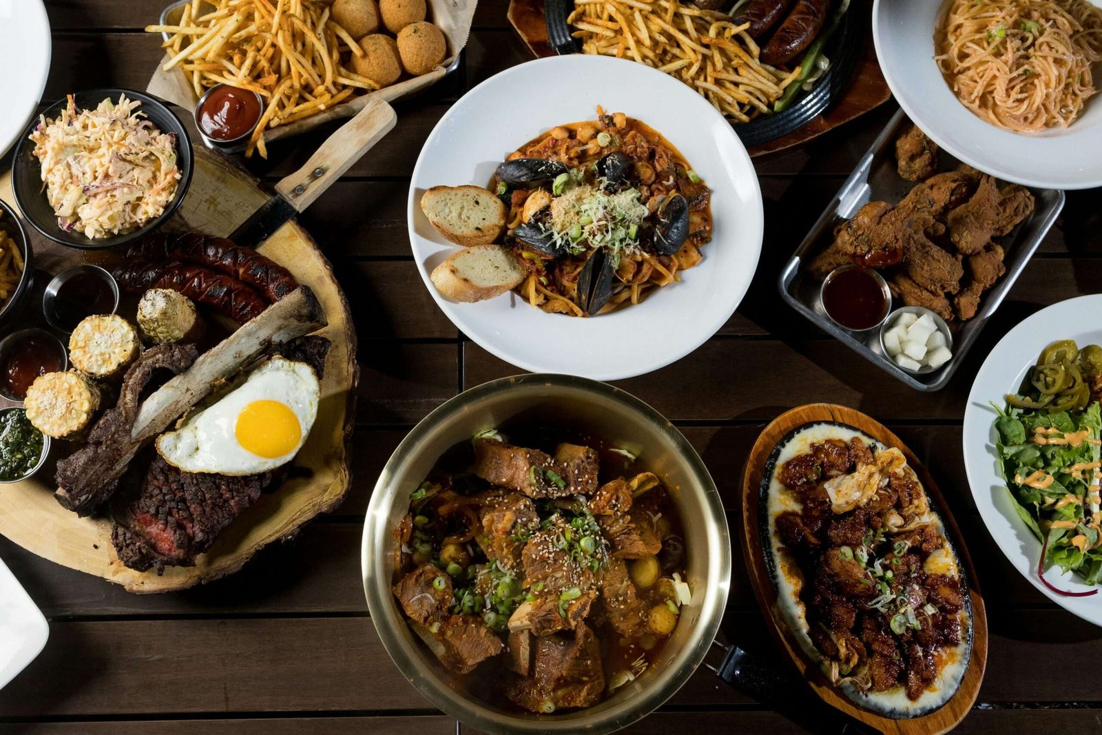 High angle view of a delectable gourmet spread featuring assorted international dishes.